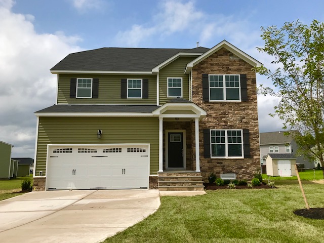 Aspen home plan built by Boyd Homes two story house with stone accent front.